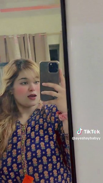 Stylish Outfit Reflection in Full-Length Mirror