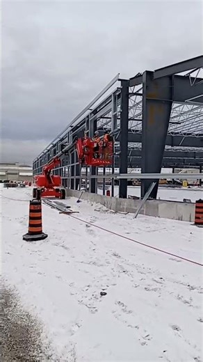Iron workers installing structural steel