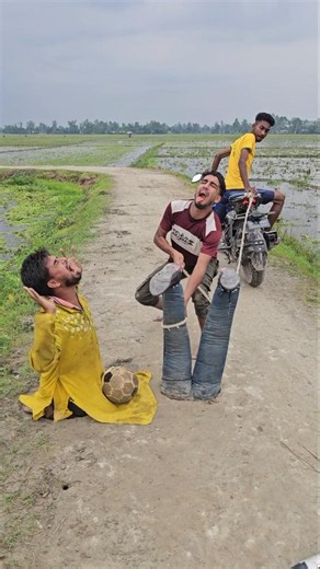 He is having fun with the two boys, rolling a ball around in his hands.213#funny #reels