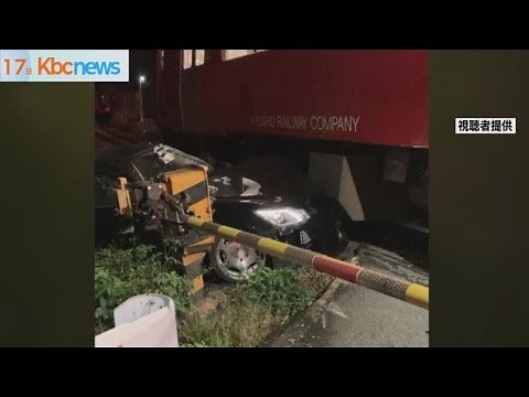 Car stuck on tracks: moment train hits