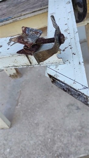 cut off the bottom of a screen door to allow clearance of new tiles over existing floor
