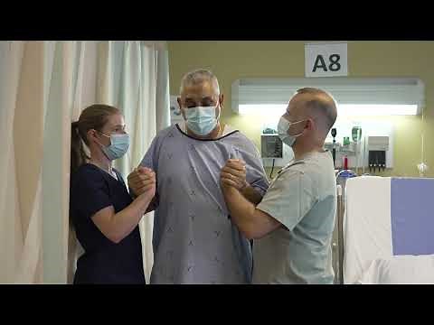 PDSB - Moving a patient from a wheelchair to a bed using lateral transfer with partial assistance