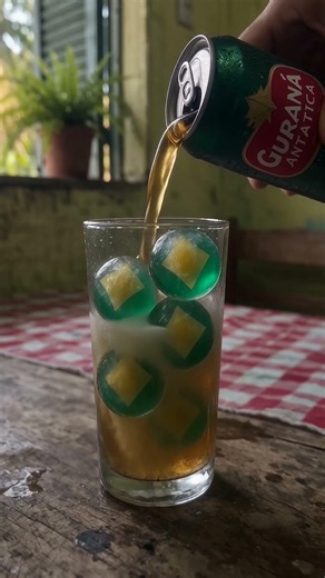 brazilian soda (guaraná antarctica) over ice balls gentle pour