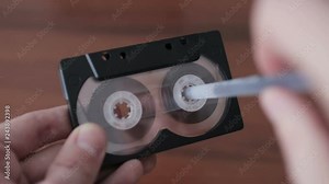 Manually Rewind a Cassette Tape With a Pen.