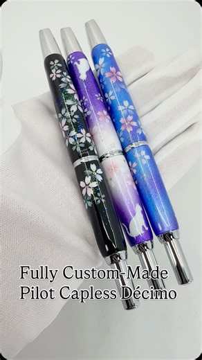 @sakura.pens on Instagram: "✨ Fully Custom-Made Pilot Capless Décimo ✨ This is a Pilot Capless Décimo, fully custom-made by a skilled Japanese artisan. Each pen is handmade to order, created exclusively based on your personal request. Every detail is carefully crafted by hand, resulting in a truly one-of-a-kind fountain pen. Here are three custom order examples: • A black-based floral design, elegant and timeless • A purple-to-white gradient design with charming cats on both ends • A blue-based