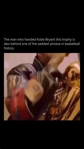 History Hidden on Instagram: "The image of Kobe Bryant holding the 2001 NBA championship trophy is far more than just a celebration shot. The photo - showing the young star sitting alone in the locker room, trophy in hand, his face marked by quiet reflection - captures both the triumph of victory and the weight of his personal struggles at that time. In 2001, Kobe and the Los Angeles Lakers had just secured their second consecutive NBA title, cementing their dynasty. But off the court, his life 
