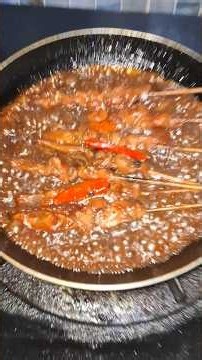 Cooking spicy sweet soy chicken satay with peanut sauce