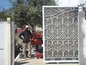 porte coulissant en fer forge