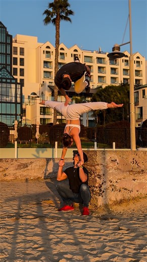 Rachel Marie on Instagram: "Did you hear that slap? 😱 Can’t even practice acro in peace anymore… @nathantsuji @erik3run #gymnastics #tricking #acro #partneracrobatics #partnerchallenge #parkour #fitness #musclebeach"