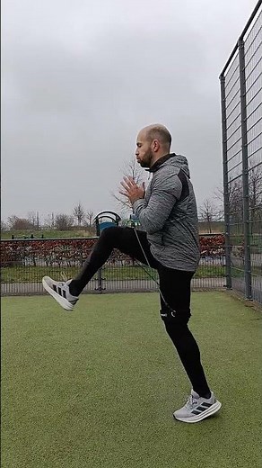 Running technique drills with speed band A skip B skip