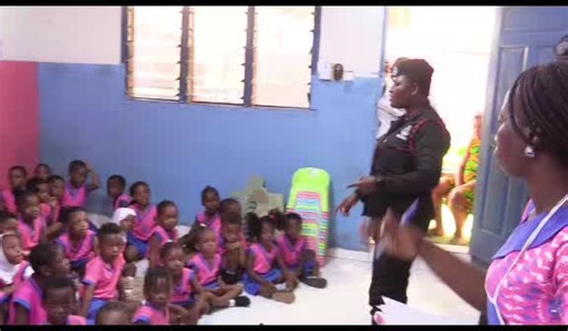 The Community Policing Unit Police Officers educating pupils of Pinks and Blues school on Police Emergency numbers