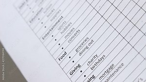 List of Monthly Household Expenses for a Basic Monthly Budget. A budget shows how much money you have coming in and how those funds are spent Stock Video