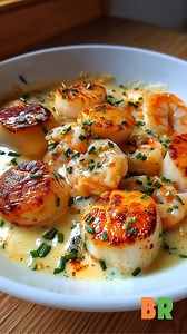 Creamy Garlic Shrimp & Scallops Bake Golden-seared shrimp and scallops baked in a rich garlic cream sauce. This is the weeknight seafood bake you'll crave on repeat! Ingredients: 1/2 lb shrimp (peeled and deveined) 1/2 lb sea scallops (patted dry) 2 tablespoons unsalted butter 4 garlic cloves, minced 1 cup heavy cream 1/2 cup grated Parmesan cheese 1 teaspoon lemon zest 1 tablespoon lemon juice 1/2 teaspoon paprika Salt and black pepper, to taste 2 tablespoons chopped fresh parsley How to Make I