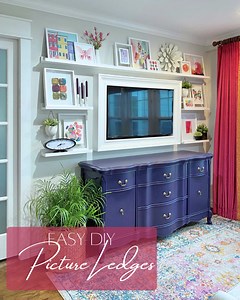 No one would ever call me a minimalist. 😃 I'm definitely in the "more is more" camp when it comes to decorating. So when I wanted to fill up this wall space so that the TV wasn't the focal point, I built these super simple picture ledges. Instructions here: https://www.addicted2decorating.com/simple-diy-picture-ledges-new-sitting-room-gallery-wall.html This is a very easy DIY project, and can be made any size you want for any amount of wall space you want to fill. In one day, you can transform