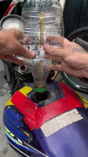 The homemade tool he built to pump fuel.A practical fix with #USA #FuelPumpHack #DIYFunction