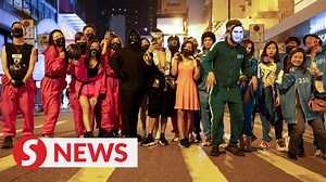 60K views · 400 reactions | Thousands of Hong Kong revellers flocked to the city's nightlife hub of Lan Kwai Fong on Saturday with "Squid Game" costumes proving popular on the night before Halloween. WATCH MORE: https://thestartv.com/c/news SUBSCRIBE: https://cutt.ly/TheStar LIKE: https://fb.com/TheStarOnline | The Star | Facebook