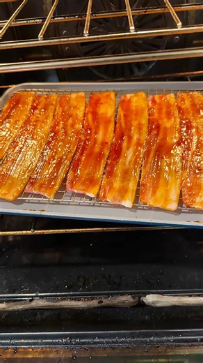 🔥🥓 Fireball Candied Bacon Fireball Candied Bacon brings serious heat and sweetness to your backyard BBQ snack game. The bold cinnamon spice from Fireball pairs perfectly with smoky, crispy bacon for a flavor combo that hits hard in the best way. This candied bacon is made for backyard cooks who like a little kick with their sweet. As it cooks, the glaze tightens up and clings to the bacon, creating sticky edges and a glossy finish that looks just as good as it tastes. The balance of heat, suga