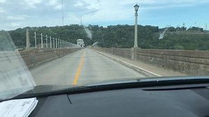 Driving over the Bagnell Dam... the dam was built in 1929 for hydro power. It was create by damming the Au Sage river and thus the Lake of the Ozarks! Apparently it has more shoreline than the coast of CA! | Sara Welch