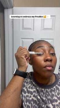 learning makeup on my face with freckles
