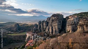 time lapse of the Monasteries of Meteora at sunset, an UNESCO World Heritage. The Holy Monastery of Roussanou. Kalambaka (Kalabaka), Greece.