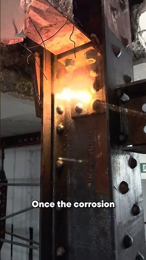 Laser cleaning rust from structural support beams inside an active industrial facility.