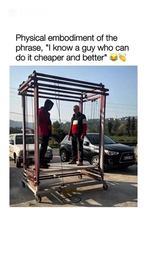 Watching this custom-built telescoping electric lift in action is a fascinating look at improvised engineering designed for reaching high warehouse ceilings without standard industrial equipment. The heart of the machine is a base-mounted electric winch that acts as the primary muscle, pulling steel cables through a series of nested rectangular frames. As the cables tighten, the inner sections slide upward along vertical rails, allowing the platform to reach several times its original height whi