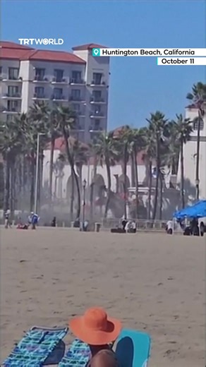 A helicopter spiralled out of control over Huntington Beach, California, crashing into palm trees near the beach. Five people were hospitalized, including two pulled from the wreckage | TRT World