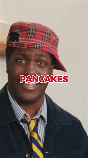 Quen puts strawberry jam on Yachty's panckes