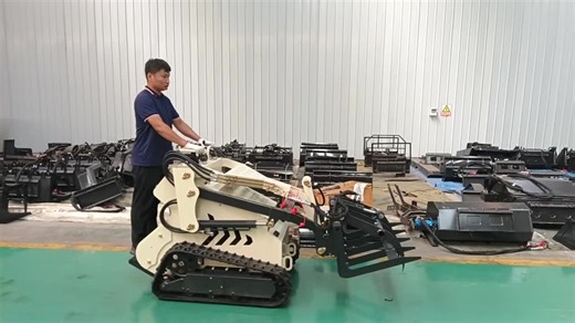 Skid steer loader with forks to lift cargo easily.#skidsteer #skidsteerloader #fork #warehouse #machine #garden #building #compact #mini #factory #equipmentoperator