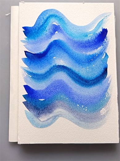 Bloom into Calm — Day 29 Blue Wave Flow (Light Dark) 💙 Today’s calming prompt: Layered waves in different blues Paint soft ocean-like waves and follow the same flow again and again, using lighter and darker shades of blue. It’s gentle, rhythmic, and super calming — like breathing with your brush 🌿🖌️ ✨ How to do it Pick 3–6 blues (pale sky blue → deep navy) Paint one flowing wave line across the page Repeat the wave shape underneath, following the same curve Swap shades as you go: light, mid, 