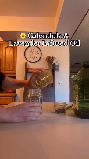All you need are dried calendula, dried lavender, and a carrier oil of your choice — I used olive oil because that’s what I had on hand. How to make it: 1. Fill a clean glass jar about halfway with dried calendula flowers. 2. Add about 1/8 cup of dried lavender. 3. Pour in enough olive oil to completely cover the herbs. Stir gently to combine. 4. Place a cloth or towel on the bottom of your crockpot (to prevent direct contact with the heat) and add water until it reaches halfway up the jar. 5. S