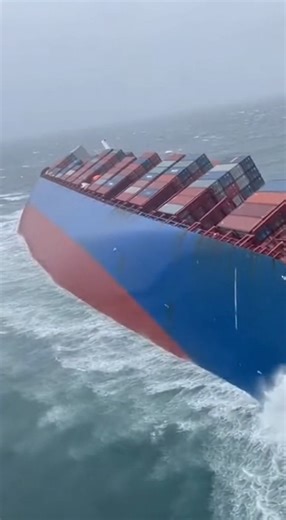 TANKER ROLLS AS COAST GUARD RACES IN FROM ABOVE Helicopter footage shows a massive cargo tanker listing violently in heavy seas as stacked containers shift and the vessel begins to roll. Waves crash over the hull while the ship struggles to stay upright, creating a rapidly escalating emergency offshore. As the ship’s angle increases, unsecured cargo appears to slide, worsening the imbalance and raising concerns of a full capsize. Crew members are believed to be sheltering inside as emergency pro