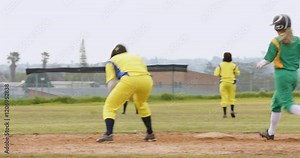 Multiracial female baseball players, catching and throwing the ball, running on a pitch