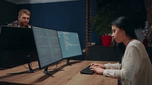 clip-1100228173-indian-female-data-scientist-writing-program-code