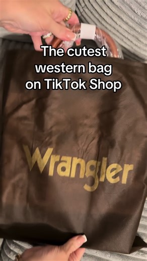 Wrangler Aztec tote from TikTok Shop and I’m obsessed 🤎 The western print, braided detail, and the size make it the perfect everyday bag. If you love western style bags, boutique fashion, and Wrangler accessories you need this one. Free shipping on TikTok Shop right now. #tiktokshopfinds #westernstyle #wranglerbag #tiktokshopcreatorpicks