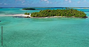 Aerial view of beautiful tropical island lagoon and white sand beach in the South Pacific