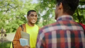 Two guys talking after university classes, student's lifestyle, friendship