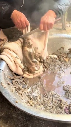 The process of removing the black membrane from beef tripe