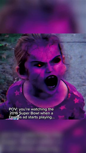 history on Instagram: "In 2016, an eerie commercial known as the “Demon Girl” Doritos ad began circulating online as a Crash the Super Bowl submission. The clip opens with a girl riding her bike down a sidewalk, handing out Doritos. An older boy steps in front of her bike, blocks her path with his foot, then snatches the chips and begins eating them in front of her. She stands silently for a moment, staring. Then her face shifts: her skin takes on a purple tint, her eyes turn dark, and she smile