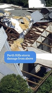 This aerial footage shows the extent of the damage to homes across the Perth Hills as a result of the freak storm that hit last night. More than 8,000 properties are without power, roofs have been torn off homes, powerlines are down and multiple roads between Great Eastern Highway and Toodyay Road in Mundaring have been closed. | ABC Perth