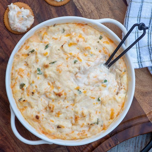 This CHEESY HOT CRAB DIP is the ultimate party snack! Lump crab meat is baked into this luxurious dip with cream cheese, sour cream, sharp cheddar cheese and few dashes of hot sauce. GET THE RECIPE: https://www.fromvalerieskitchen.com/cheesy-hot-crab-dip/ | Valerie's Kitchen
