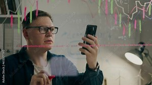 Sticky notes manager consultant keeps uses touch phone in a stylish conference room. Camera in motion young professional develops business strategy with the help of modern technology, statistics