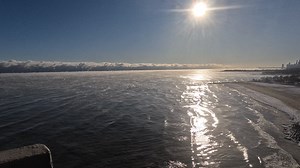 The lake-effect clouds boiling out over Lake Michigan in this time lapse video shot from my balcony looking east from Chicago's North Side Edgewater neighborhood in Sunday morning's bitter chill is really quite stunning. Also interesting is the "steam"--referred to as "sea smoke"--which shows up with particular clarity as the rising sun illuminates it with particular clarity. The "steam" is an outgrowth of the destabilizing of the atmosphere which occurs as frigid arctic air pours out over the "