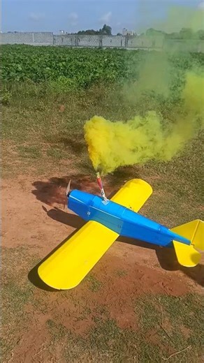 RC plane flying with colour smoke