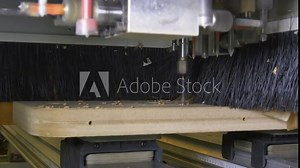 Ergonomic Flat Table CNC Router and Machining Center at woodworking and furniture Industry. Manufactures milling grooves, curved surfaces and drill all the required holes for the pieces of wood. Stock Video