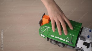 toy truck. recyclable materials. garbage disposal machine. slow motion video. High-quality shooting in 4K
