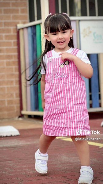 Cute Little Model Showcasing Fun Outfits