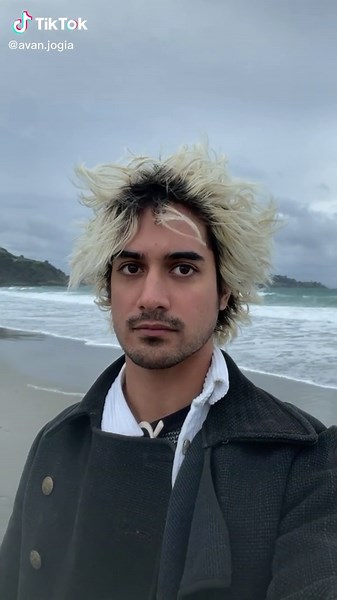 Serene Beach Scene with Distinctive Spiky Hair