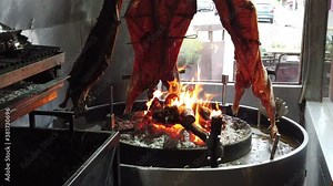 Lamb An asado is a roasted meat of beef or various other meats, which are cooked on a typical barbecue with vertical grills placed around at fire and embers in a big brazier. It is a traditional dish