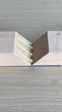 A secure way to fasten cable to wood using nails.